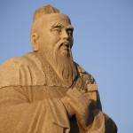 An old stone statue of Confucius