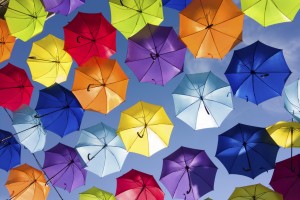 Colorful umbrellas in the sky, street decoration. Colorful background